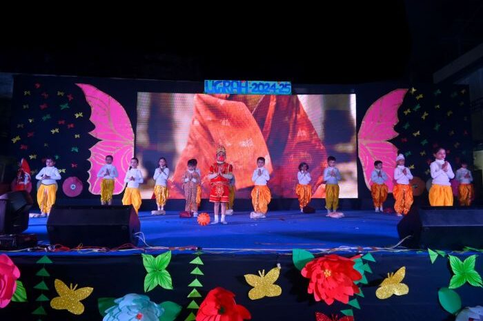 Children performing on stage with decorations.
